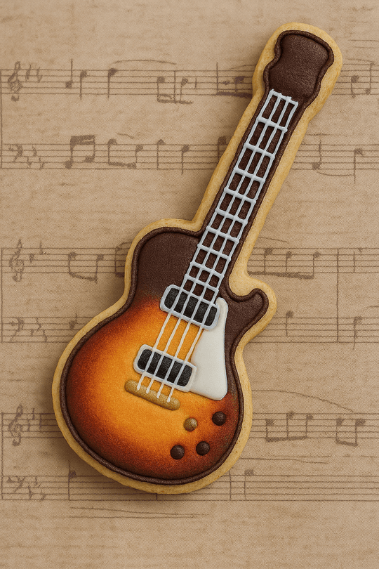 Cookie shaped like a guitar on sheet music