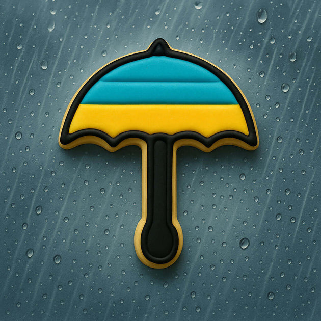 Cookie-shaped umbrella with blue and yellow stripes on a textured gray background from a 3 inch Umbrella Metal Cookie Cutter