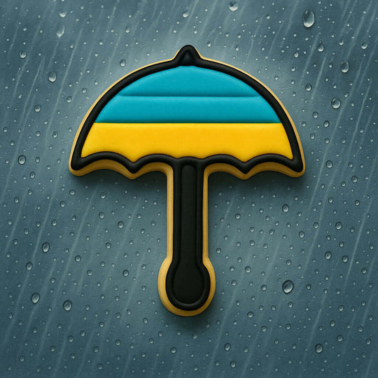 Cookie-shaped umbrella with blue and yellow stripes on a textured gray background