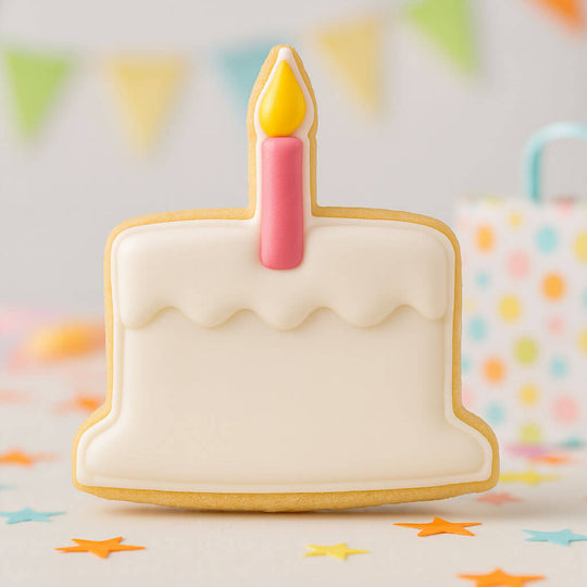 Cookie shaped like a birthday cake with a candle on a colorful background