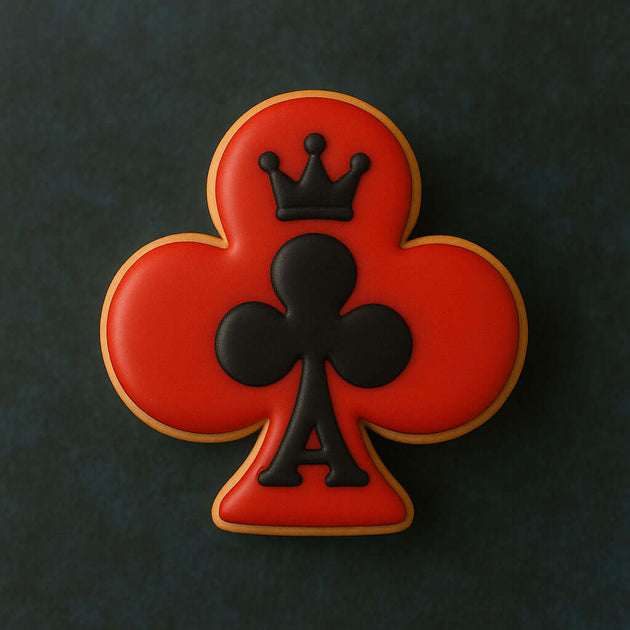 Cookie with a red clover design and black king of clubs symbol on a dark background from a 3.5 inch Club Metal Cookie Cutter