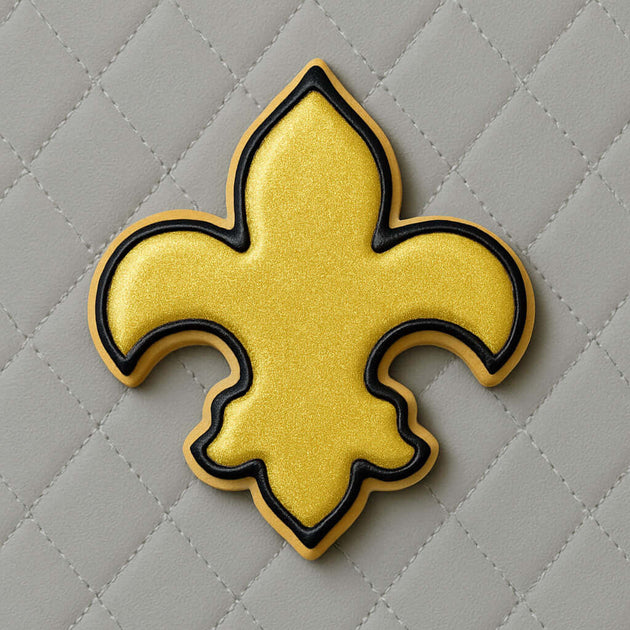 Yellow and black fleur-de-lis design on a gray quilted background from a 4.5 inch Fleur de Lis Metal Cookie Cutter