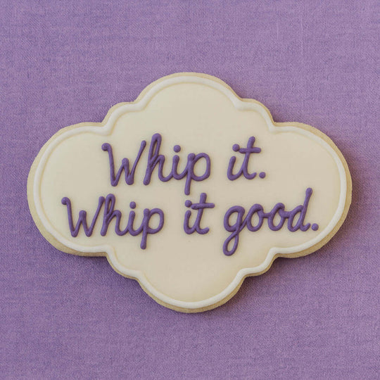 4.5 inch Plaque Metal Cookie Cutter shaped cookie decorated with purple icing saying 'Whip it. Whip it good.'