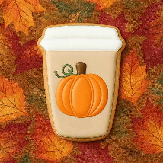 Pumpkin spice latte cookie with a pumpkin on top against an autumn leaf background from a 4 inch Paper Coffee Travel Mug Metal Cookie Cutter
