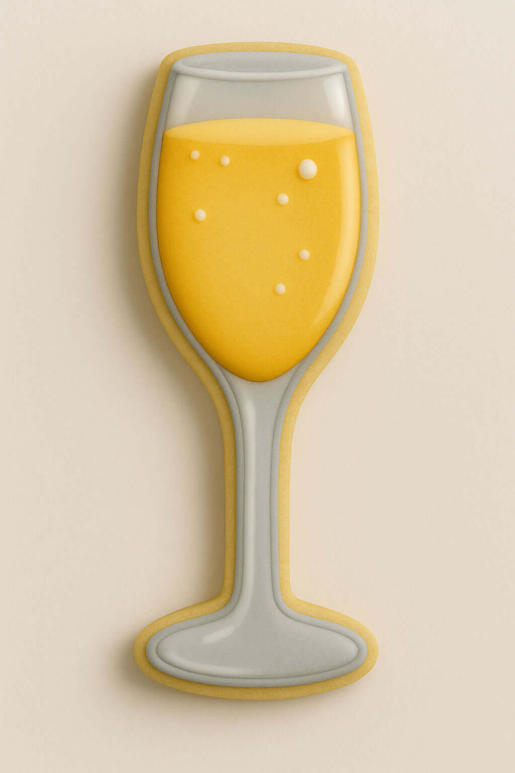 Decorative cookie shaped like a champagne glass with yellow filling on a beige background from a 5.25 inch Champagne Glass Metal Cookie Cutter