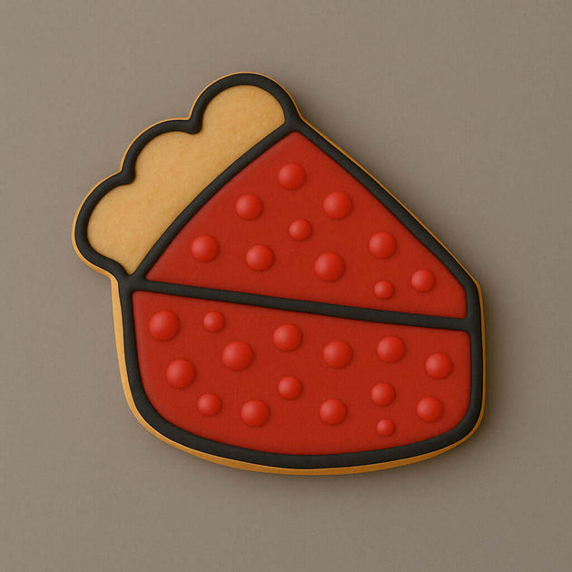 Cookie in shape of slice of pie with red and yellow design on a brown background from a 4 inch Slice of Pie Metal Cookie Cutter