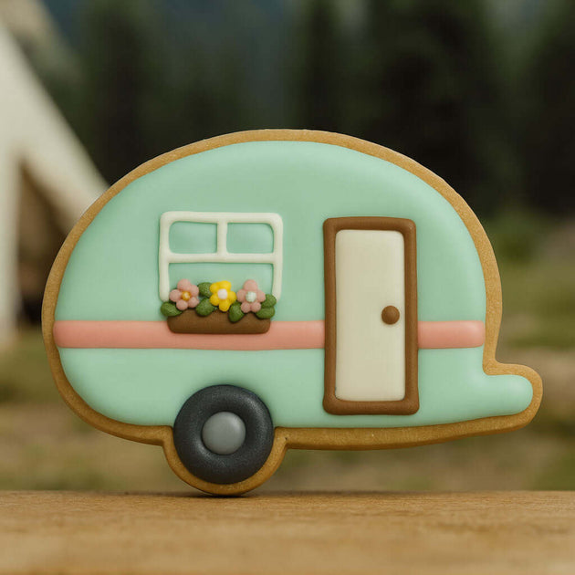 Decorative cookie shaped like a camper with a door and window from a 4.5 inch Camper RV Metal Cookie Cutter