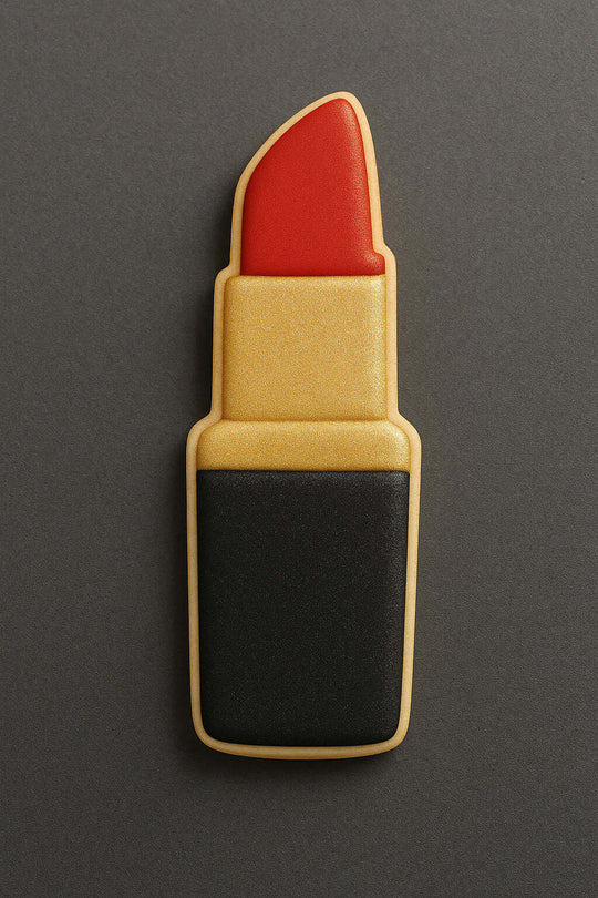 Cookie shaped like a lipstick on a gray background from a 3.5 inch Makeup Lipstick Metal Cookie Cutter