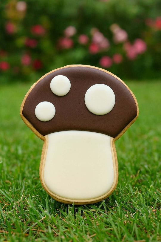 mushroom shaped cookie on a grass background