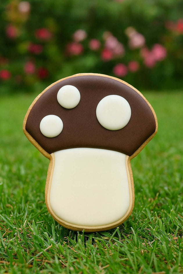 mushroom shaped cookie on a grass background