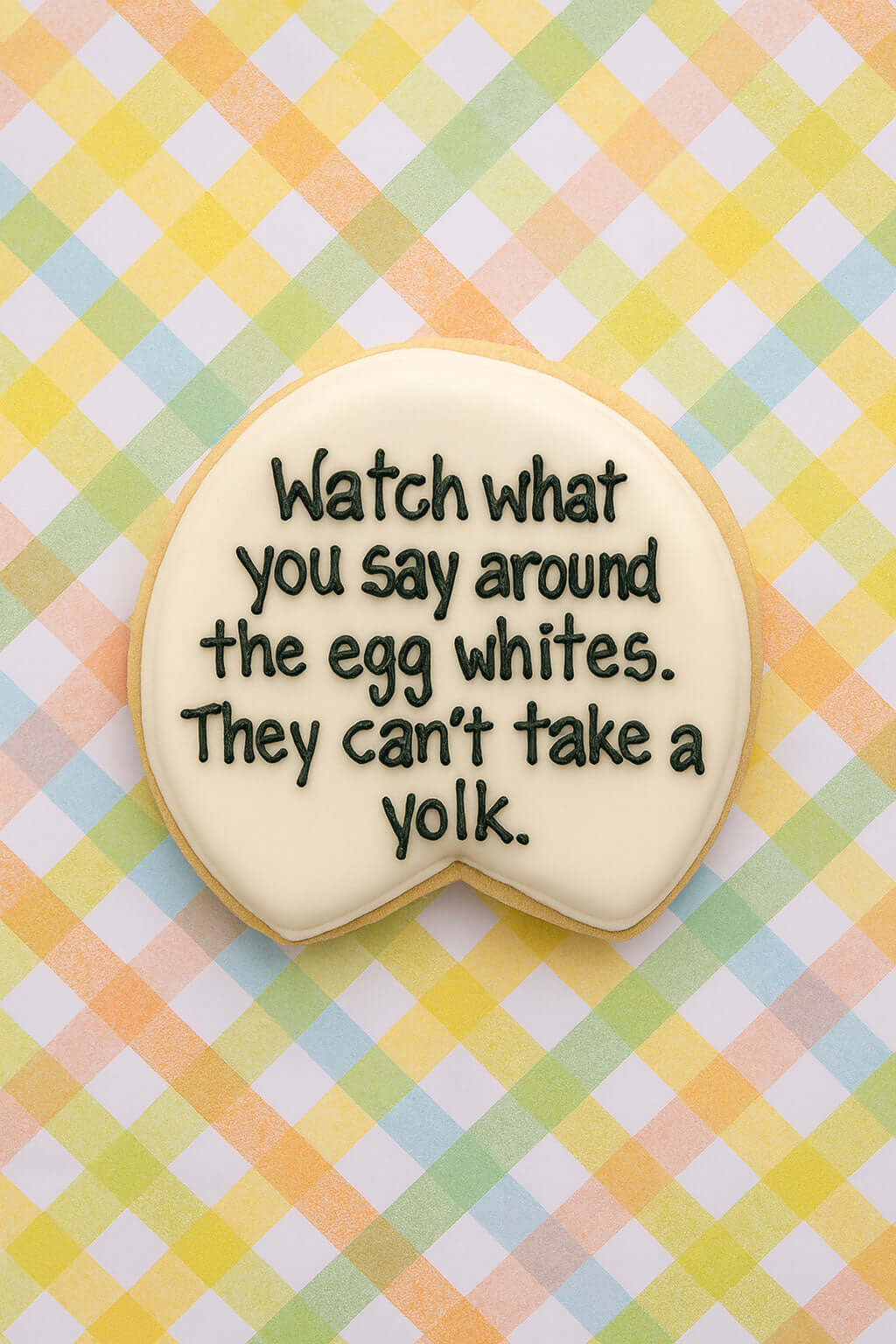 Decorative cookie with a humorous message on a checkered background