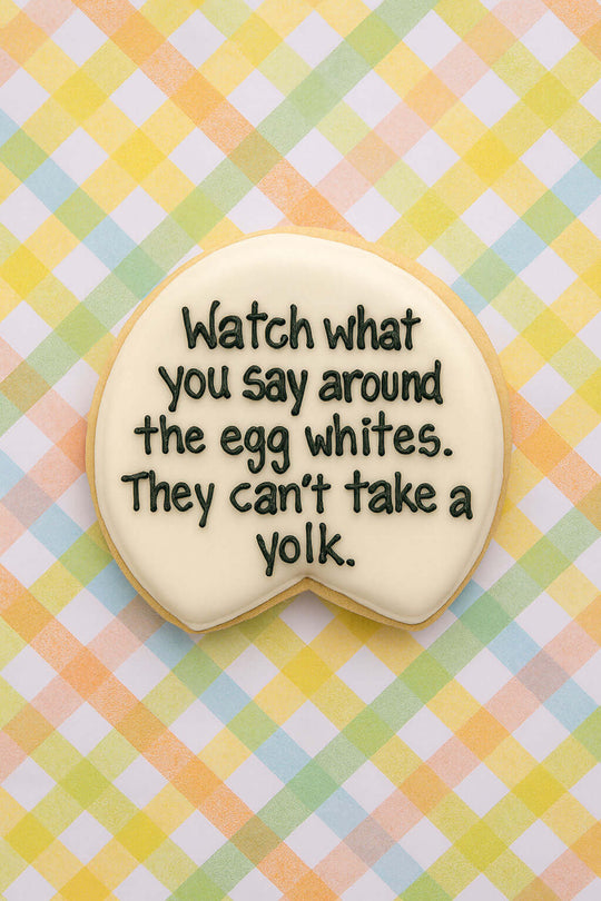 Decorative cookie with a humorous message on a checkered background