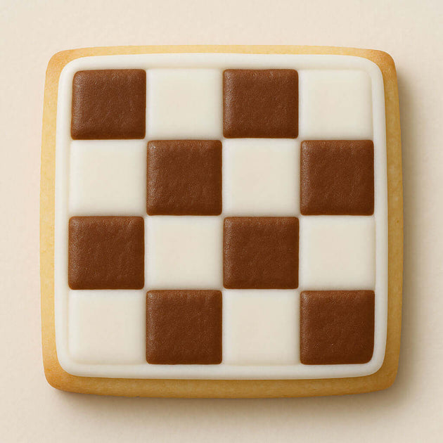Square cookie with a checkered pattern of brown and white squares on a beige background from a 4.5 inch Square Biscuit Metal Cookie Cutter