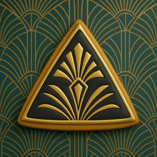 Decorative triangle emblem with gold and black design on a green background