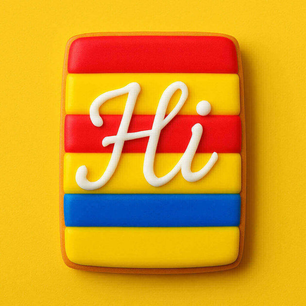 Cookie with colorful stripes and 'Hi' text on a yellow background from a 2 inch X 1.125 inch Rectangle Biscuit Metal Cookie Cutter