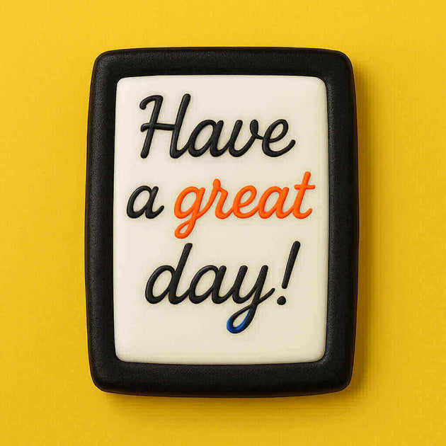 Cookie with 'Have a great day!' text on a yellow background from a 2.5 inch X 1.43 inch Rectangle Biscuit Metal Cookie Cutter