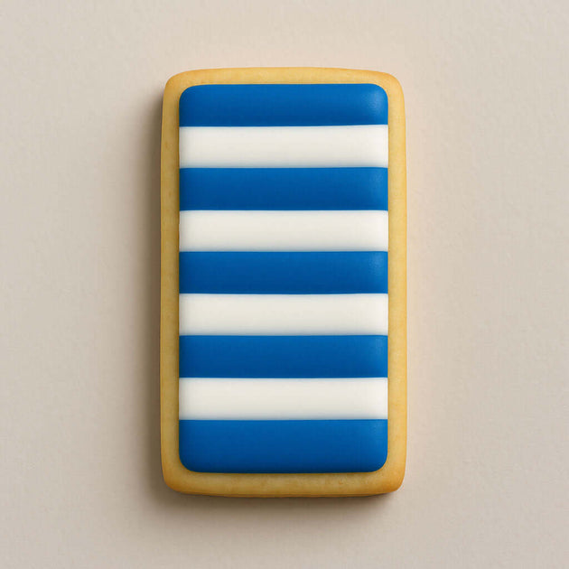 Rectangular cookie with blue and white stripes on a beige background from a 2 inch Cookie Stick Metal Cookie Cutter