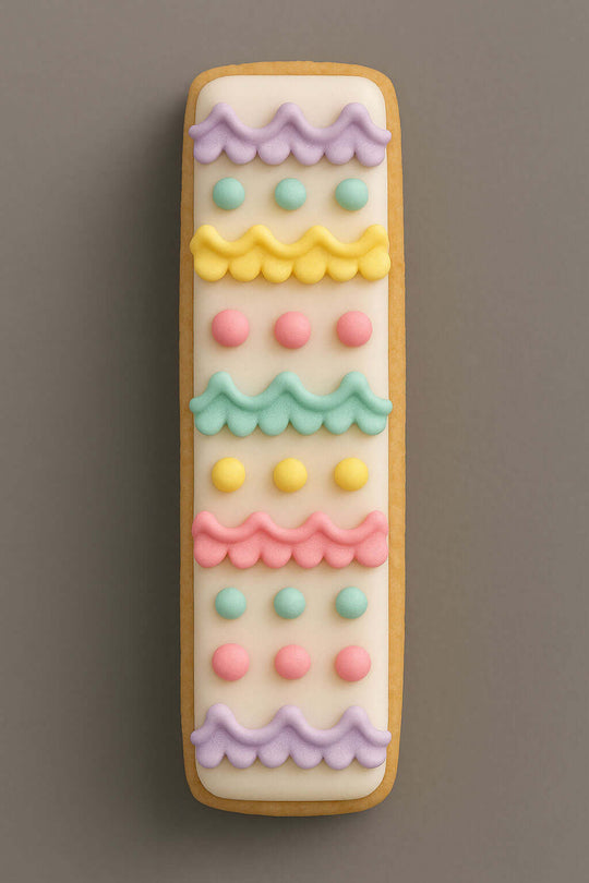 Decorative cookie with colorful icing patterns on a brown background