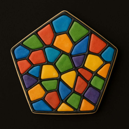 Colorful geometric tile patterned pentagon cookie on a black background from a 3.5 inch Pentagon Metal Cookie Cutter