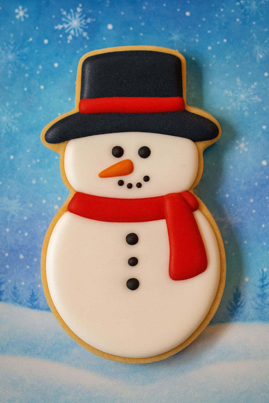 Snowman cookie with a blue snowy background from a 4.5 inch Snowman Metal Cookie Cutter