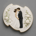Decorative cookie with a bride and groom design on a gray background from a  4.75 inch Plaque or Frame Metal Cookie Cutter