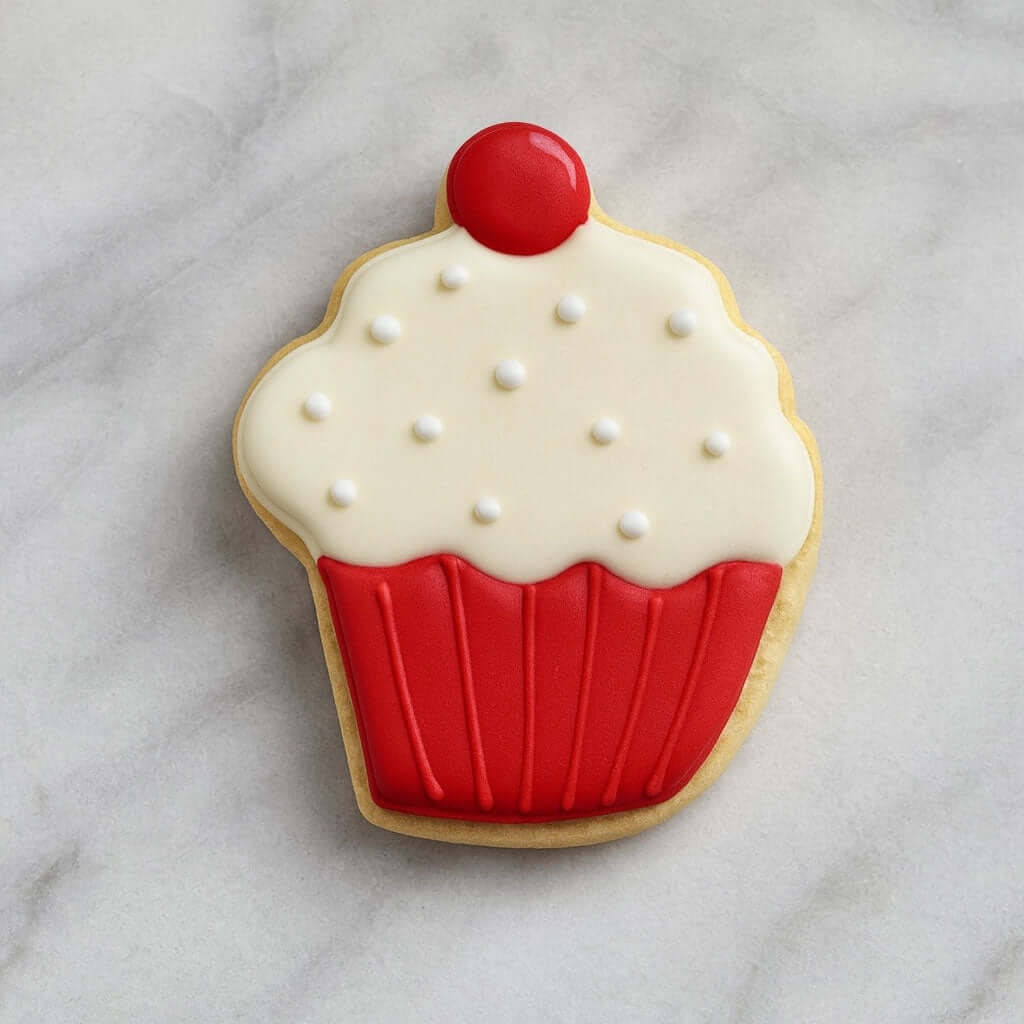 4 inch Hot Cocoa Coffee Mug Metal Cookie Cutter shaped cookie decorated with white icing, red frosting, and a cherry on top.