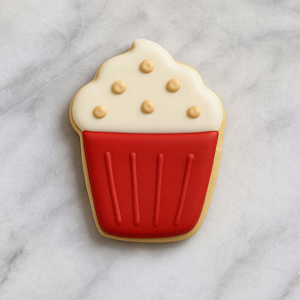 4 inch Hot Cocoa Coffee Mug Metal Cookie Cutter surrounded by festive cookies on a marble surface.