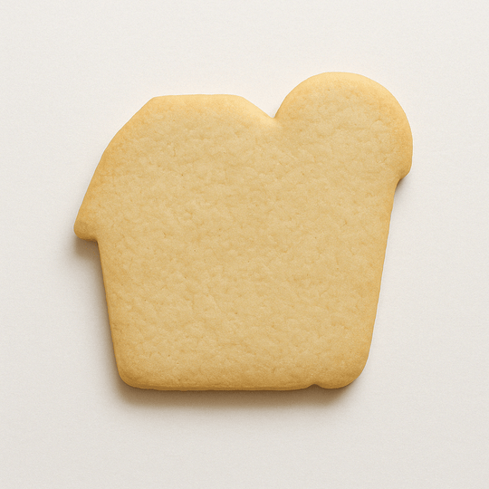 Cookie shaped like a barn on a white background from a 4 inch Barn Metal Cookie Cutter