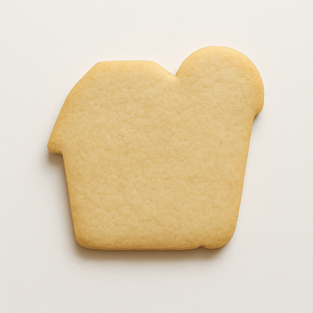 Cookie shaped like a barn on a white background from a 4 inch Barn Metal Cookie Cutter
