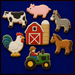 A set of farm-themed sugar cookies arranged on a dark blue background, from a Set of Farm Metal Cookie Cutters