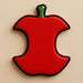 Red apple-shaped object with a green stem on a beige background from a 2 inch Mini Apple Core Metal Cookie Cutter