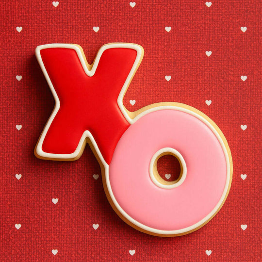 Red and pink letter  cookies on a red background with white hearts 2 inch Mini Hugs and Kisses Metal Cookie Cutter