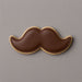 Cookie shaped like a mustache on a gray background from a 2 inch Mini Mustache Metal Cookie Cutter