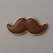 Cookie shaped like a mustache on a gray background from a 2 inch Mini Mustache Metal Cookie Cutter