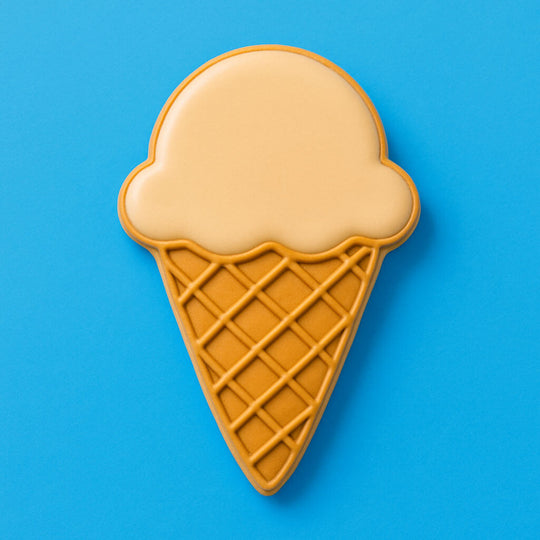 Ice cream cone-shaped cookie on a blue background from a 2 Inch Mini Ice Cream Cone Metal Cookie Cutter