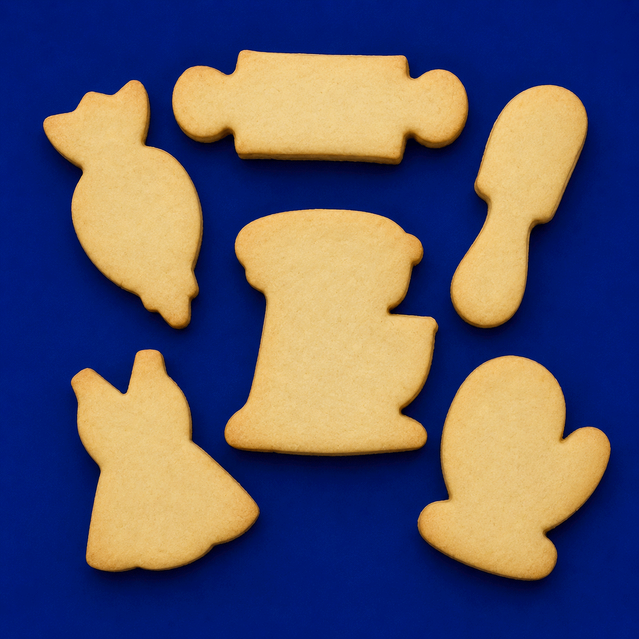 Baking items plain cookies from a  Set of Baking Metal Cookie Cutters