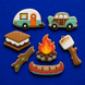 Set of cookie-shaped campfire-themed items on a blue background from a Set of Camping Metal Cookie Cutters