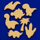 Set of beige dinosaur and palm tree cookie cutters on a blue background from a Set of Dinosaur Metal Cookie Cutters