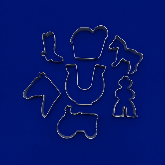 Set of metal cookie cutters with horse and cowboy designs on a blue background from a  Set of Ranch Metal Cookie Cutters