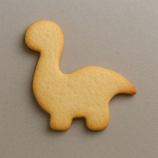 4 inch Brontosaurus Metal Cookie Cutter cookie shaped like a dinosaur on a gray background.
