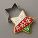 Decorative star-shaped cookie with snowflake design next to a metal star-shaped cookie cutter on a gray background from a 2.5 inch Star Metal Cookie Cutter