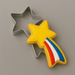 A 4 inch Shooting Star Metal Cookie Cutter with a decorated star-shaped cookie inside, shown on a smooth gray background.