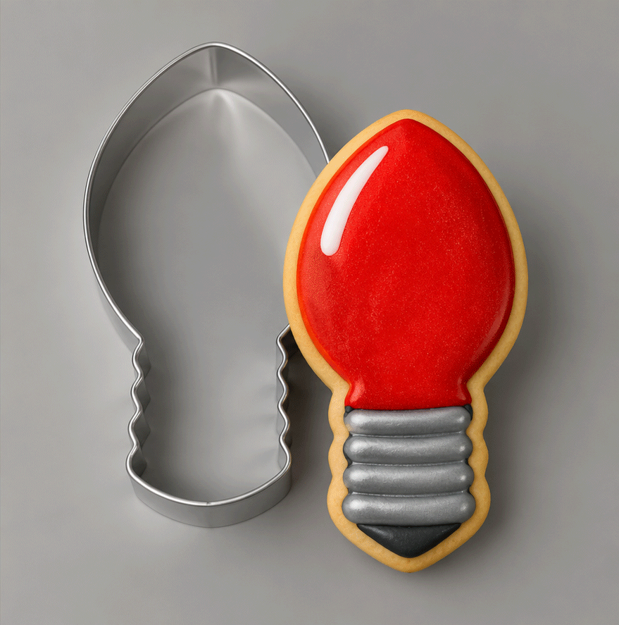 A 4.5 inch Light Bulb Metal Cookie Cutter and a matching decorated lightbulb-shaped cookie on a plain taupe background.