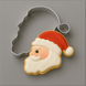 4 inch Santa Face Metal Cookie Cutter with a decorated cookie on a gray background
