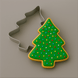 A sprinkled Christmas tree cookie and a 3.5 inch Christmas Tree Metal Cookie Cutter