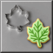 Green and white  ivy leaf cookie and a 3.5 inch Ivy Leaf Metal Cookie Cutter