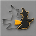 A Halloween-themed cookie cutter set on a gray background, featuring a witch silhouette cutter with a black and yellow decorated cookie inside, and a 3.75 inch Flying Witch Metal Cookie Cutter behind it.