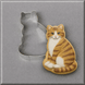 A tabby cat cookie in front of a 3 inch Pussy Cat Metal Cookie Cutter