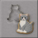 A grey cat cookie in front of a 3 inch Kitten Metal Cookie Cutter
