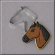 A brown and black horse head next to a 4.5 inch Horse Head Metal Cookie Cutter